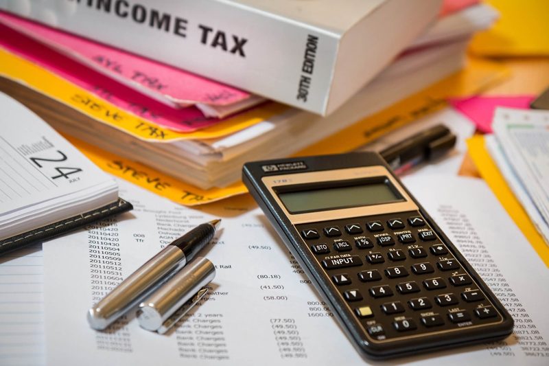 Income tax forms and a calculator